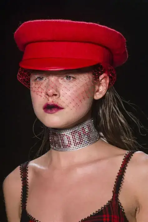 Bold Moves: Red Cap and Veil Runway Style